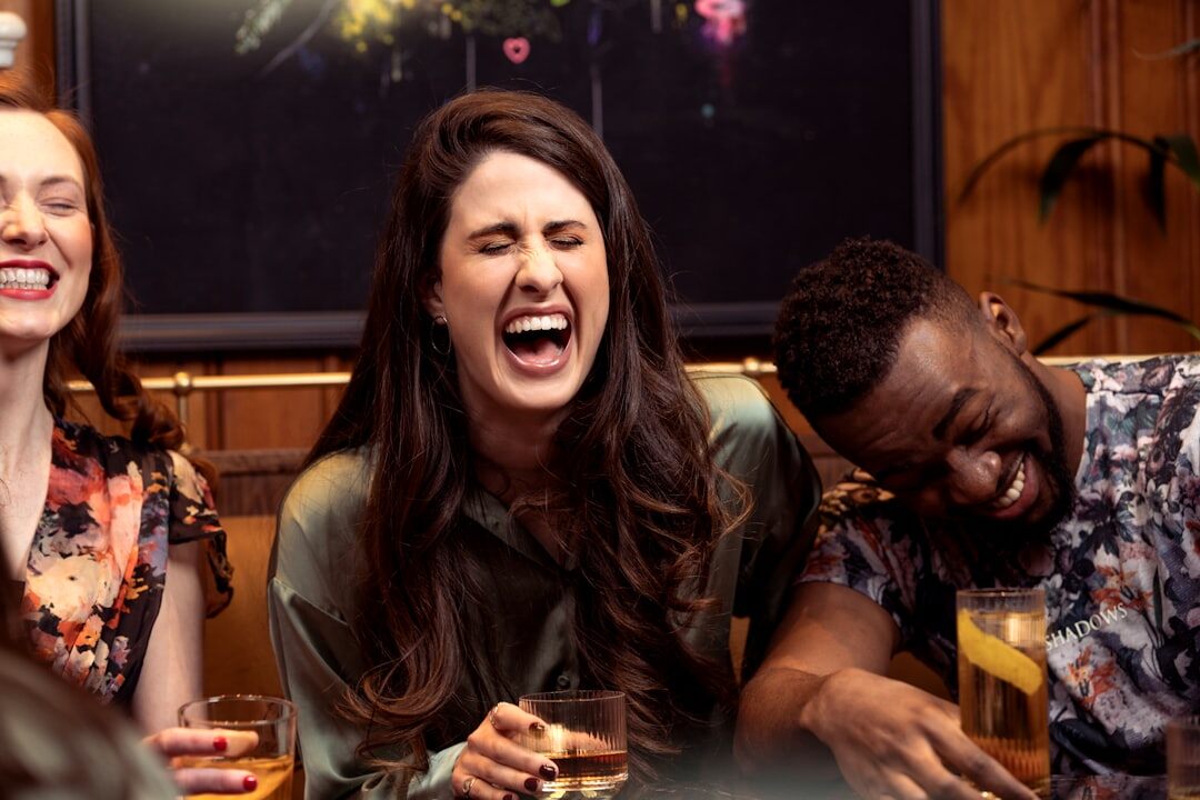 group of friends laughing after argument